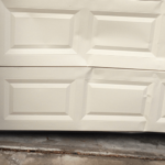 broken garage door panel repair